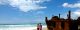 A man and a woman stand on a beach on Fraser Island