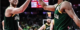 Two members of Australia's basketball team high five.